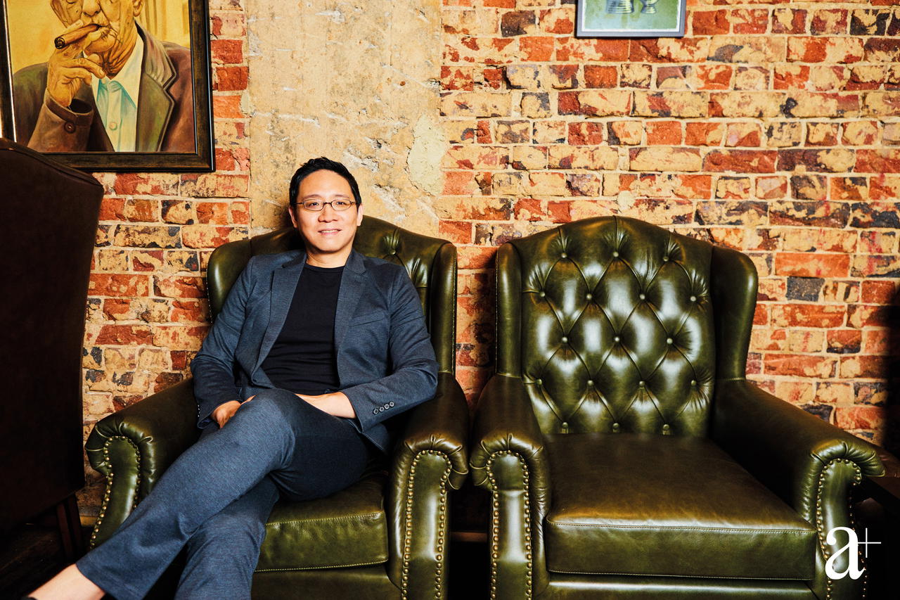 Zac Lam sitting on his leather chair