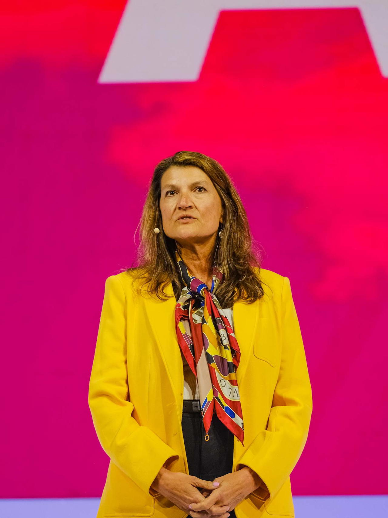 Lynn Anstett on stage speaking at the Global Leadership Conference 2023