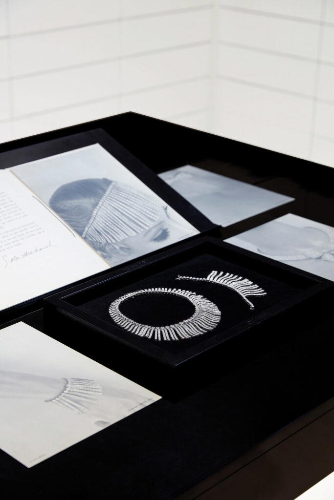 Faithful re-editions of the Nœud and Franges jewellery, displayed with documents extracted from the original 1932 press kit and archive pictures