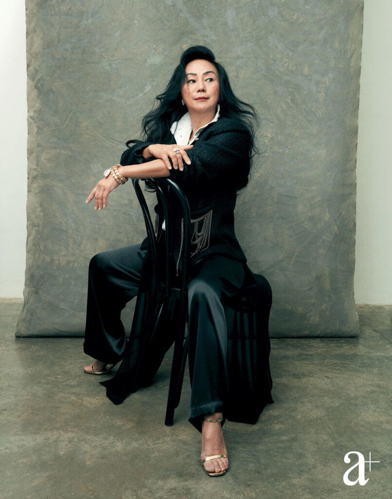 Claire Chiang straddles a chair