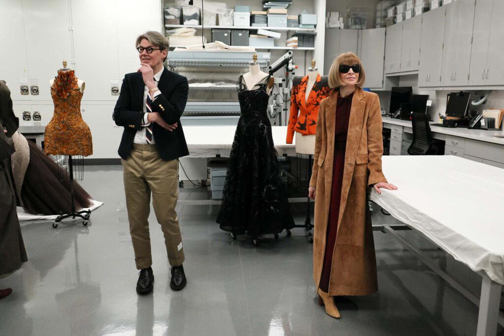 Andrew Bolton (left) and Anna Wintour speak to members of the press as The Metropolitan Museum of Art announces the The Costume Institute's spring 2024 exhibition, Sleeping Beauties: Reawakening Fashion, at The Metropolitan Museum of Art