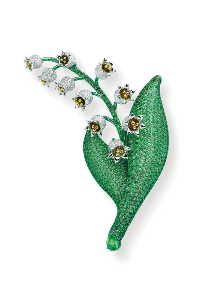 Brooch with lily of the valley motif in ethical yellow and white gold and titanium with tsavorites and diamonds