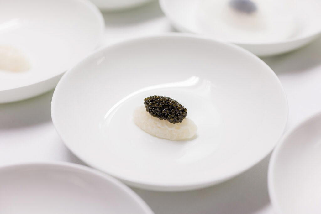 Cured squid with poultry consommé and caviar by Javier Torres