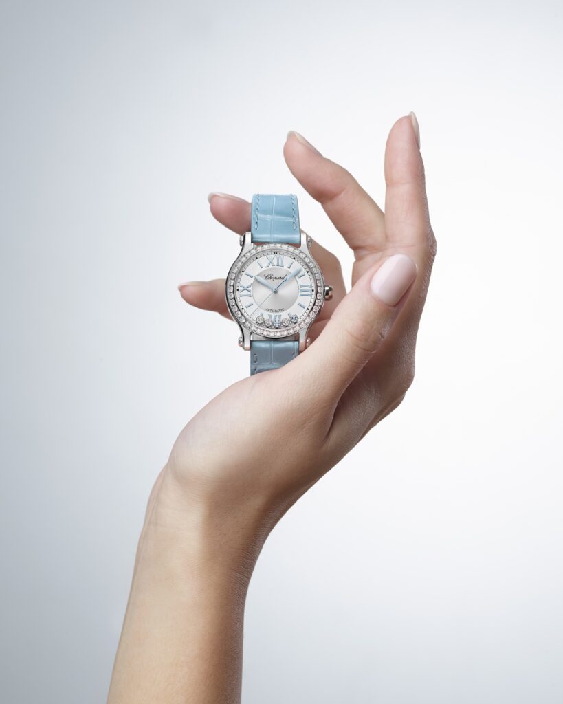 The new Chopard Happy Sport features an aquamarine on the dial for the first time