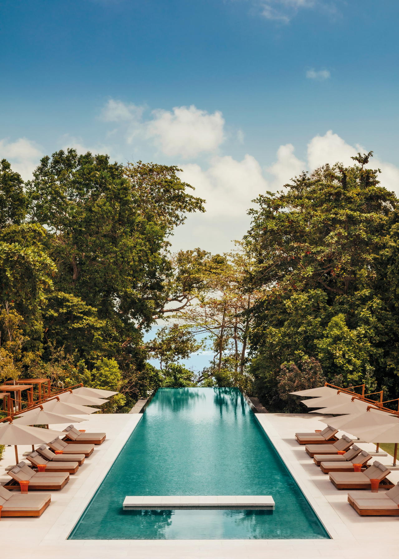 A secluded oasis surrounded by lush jungle flora and the South China Sea