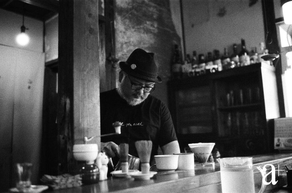 A barista at Cafe Salon Nakaoku, just one of many charming cafés on Naoshima, prepares my cappuccino