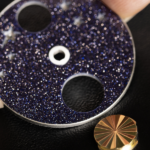 Fitting the yellow gold guilloche sun in the aventurine glass disc (Credit: Johann Sauty)