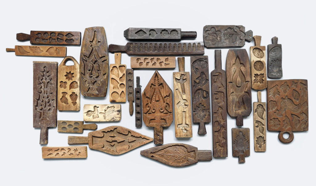 A photo of traditional wooden kueh moulds in Khir’s book