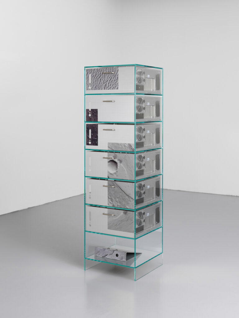 The Ore Streams Cabinet pairs transparent glass with six empty computer towers serving as drawers