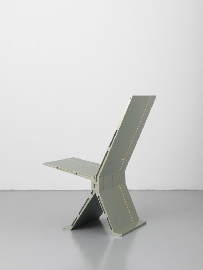 The Ore Streams Low Chair is made from CNC milled aluminium, gold-plated aluminium, and various mobile phone components