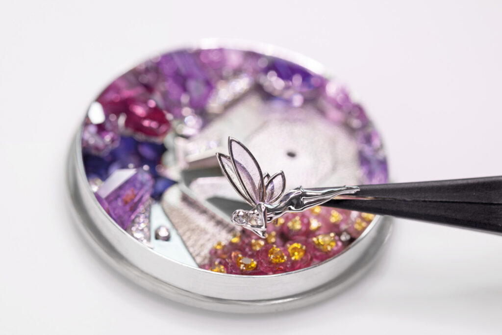 A white gold fairy with plique-a-jour enamel wings