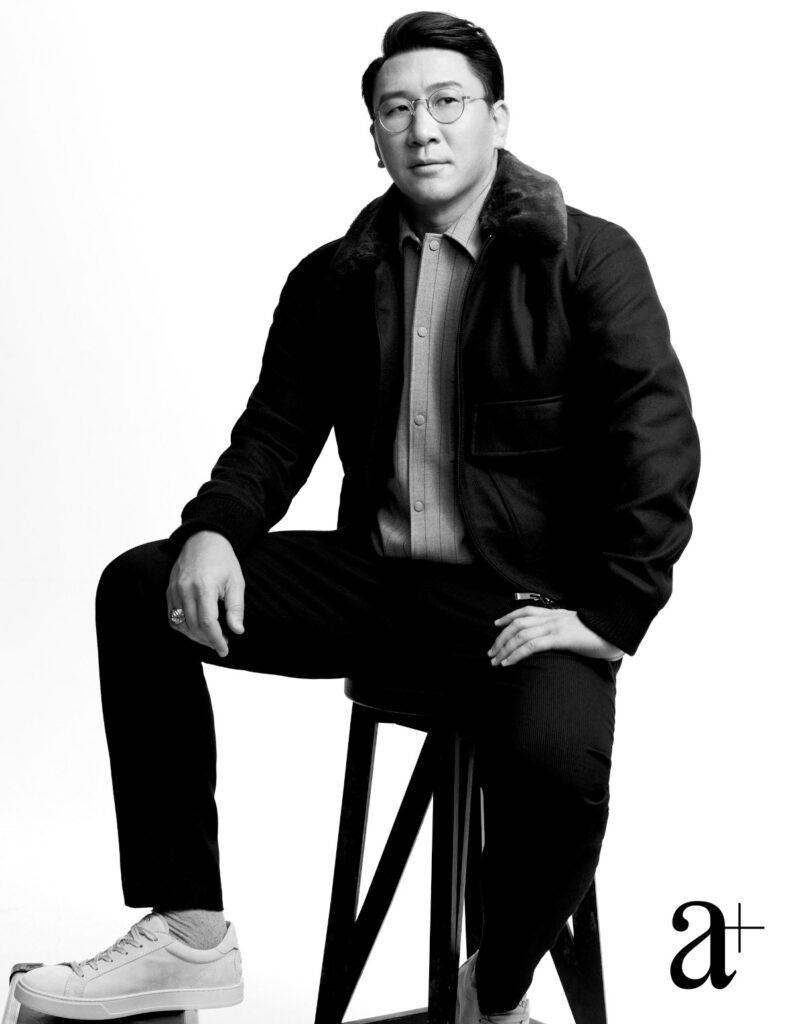 Wool shirt, bomber jacket with shearling collar, and trousers, all from Boss. Calfskin sneakers, from Tod’s (Credit: Joel Low)