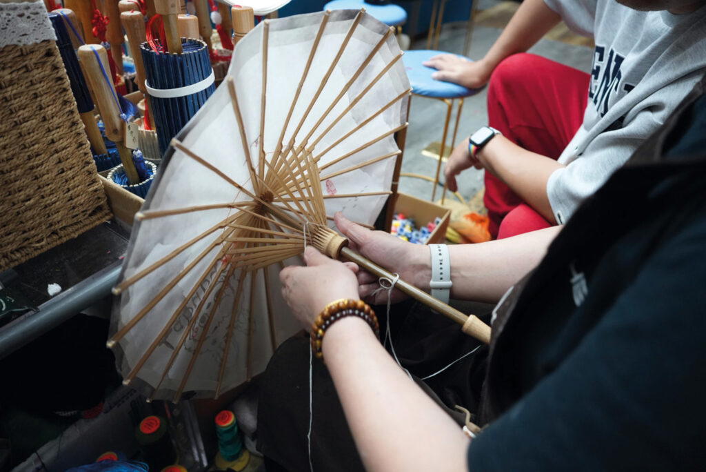 Making a paper umbrella at Hangzhou Arts & Crafts Museum