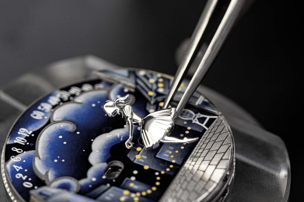 The lovers and cobblestones are handcrafted in white gold