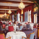 Le Restaurant at Badrutt’s Palace overlooks Lake St. Moritz and the stunning mountains. Photo: Badrutt’s Palace Hotel