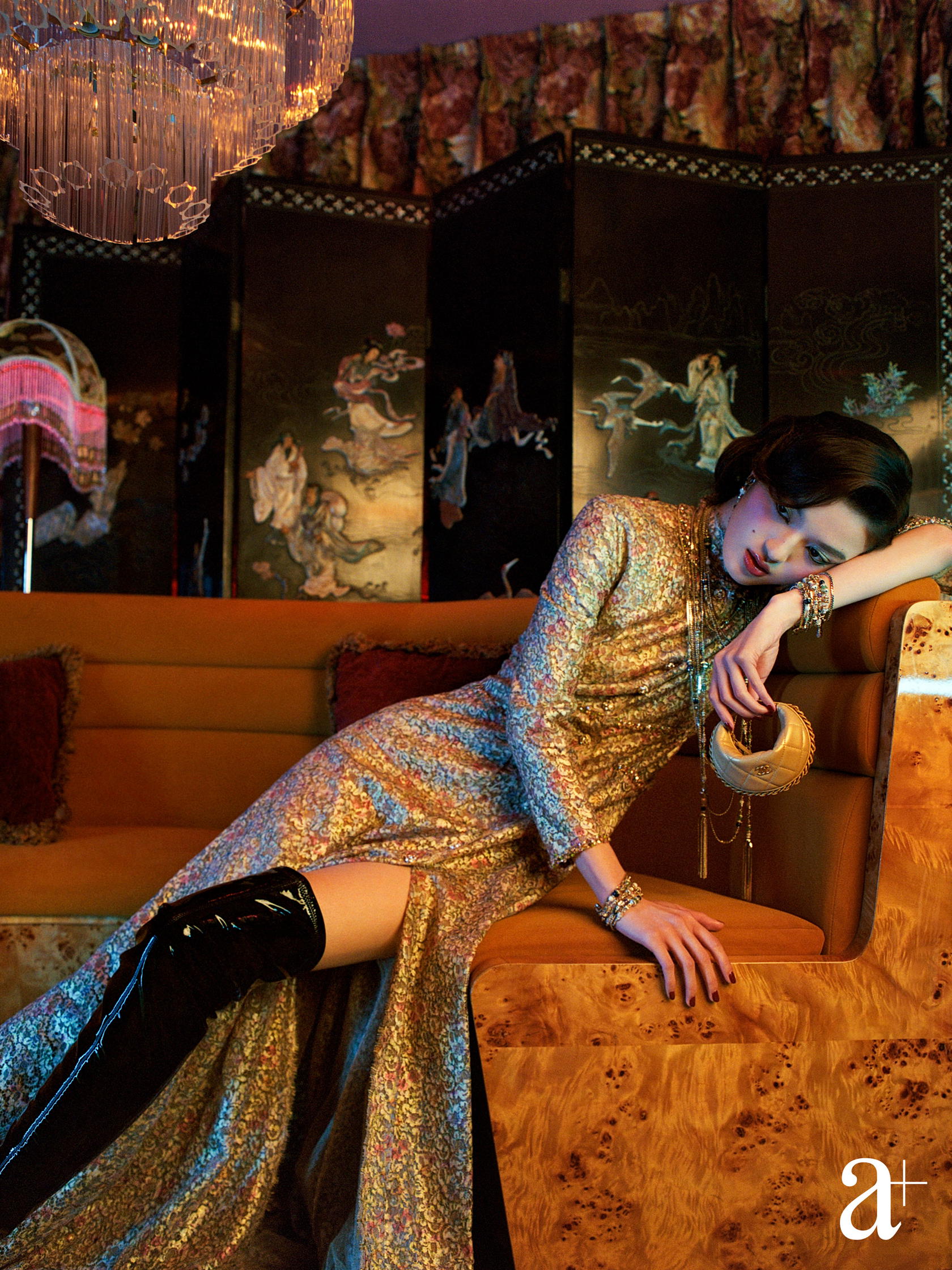 Lurex turtleneck, embroidered cashmere and viscose cardigan with jewelled buttons, embroidered viscose dress, and shiny leather bag and metal earrings, from Chanel (Photography: Stefan Khoo)