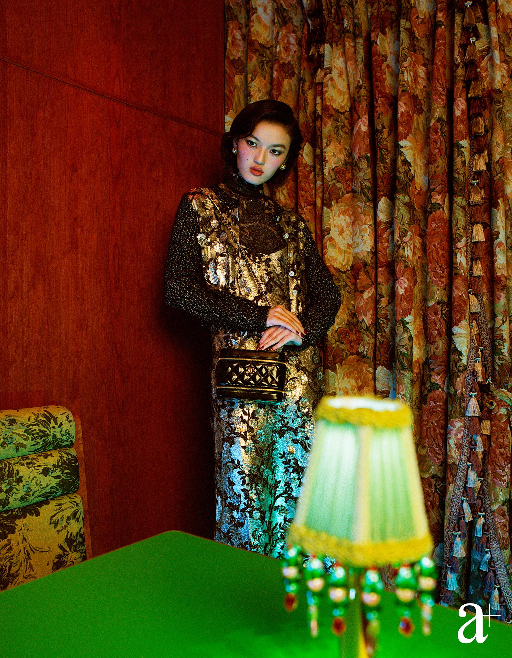 Lurex turtleneck, embroidered cashmere and viscose cardigan with jewelled buttons and embroidered viscose dress, and shiny leather bag and metal earrings, from Chanel (Photography: Stefan Khoo)
