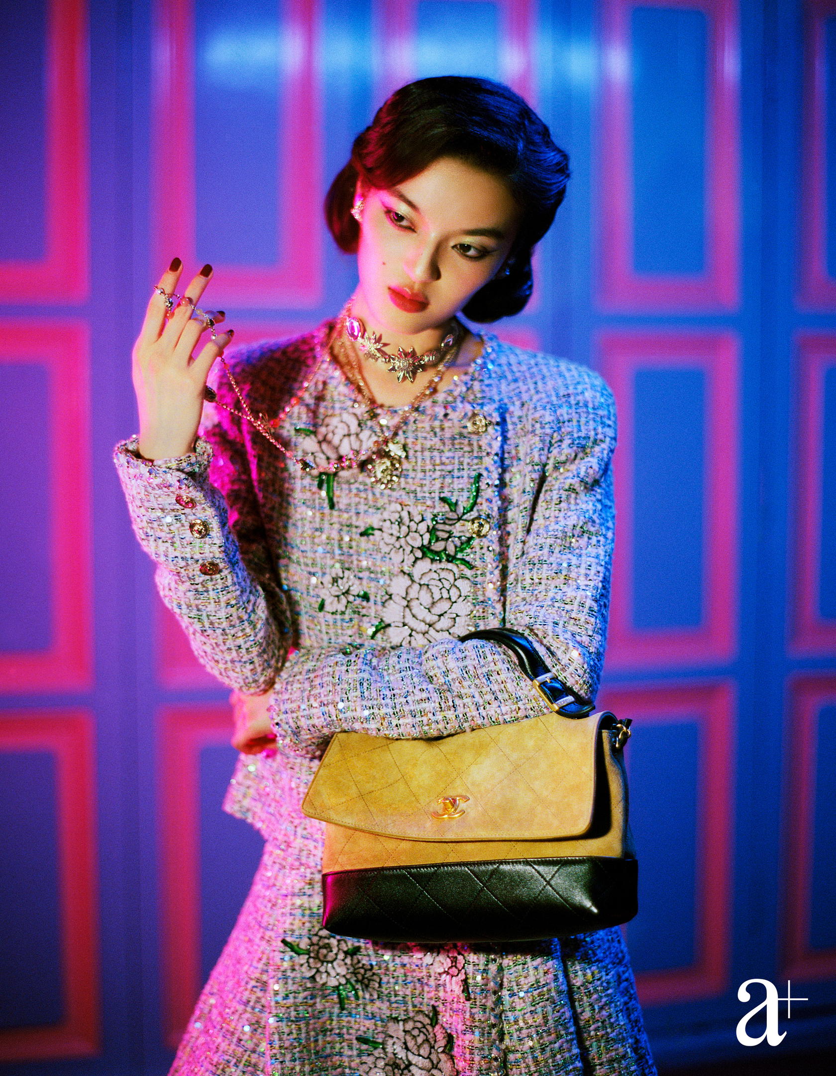 Embroidered Fantasy tweed jacket with jewelled buttons and matching skirt, metal, glass and strass necklaces, and suede and calfskin flap bag, from Chanel (Photography Stefan Khoo)