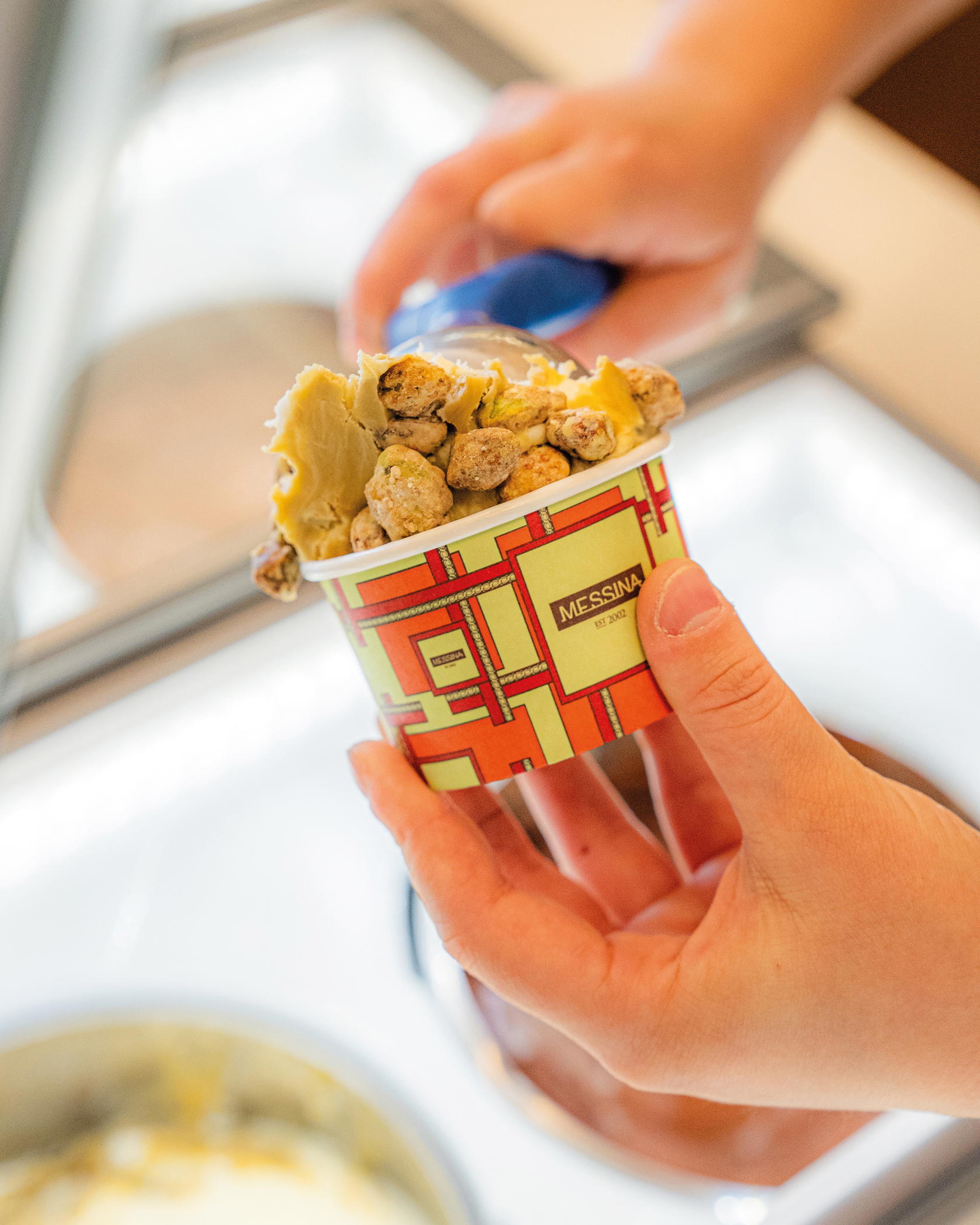 Pistachio Praline with pistachio cream and biscuit enrobed in white chocolate and finely chopped pistachios. Photo: Gelato Messina