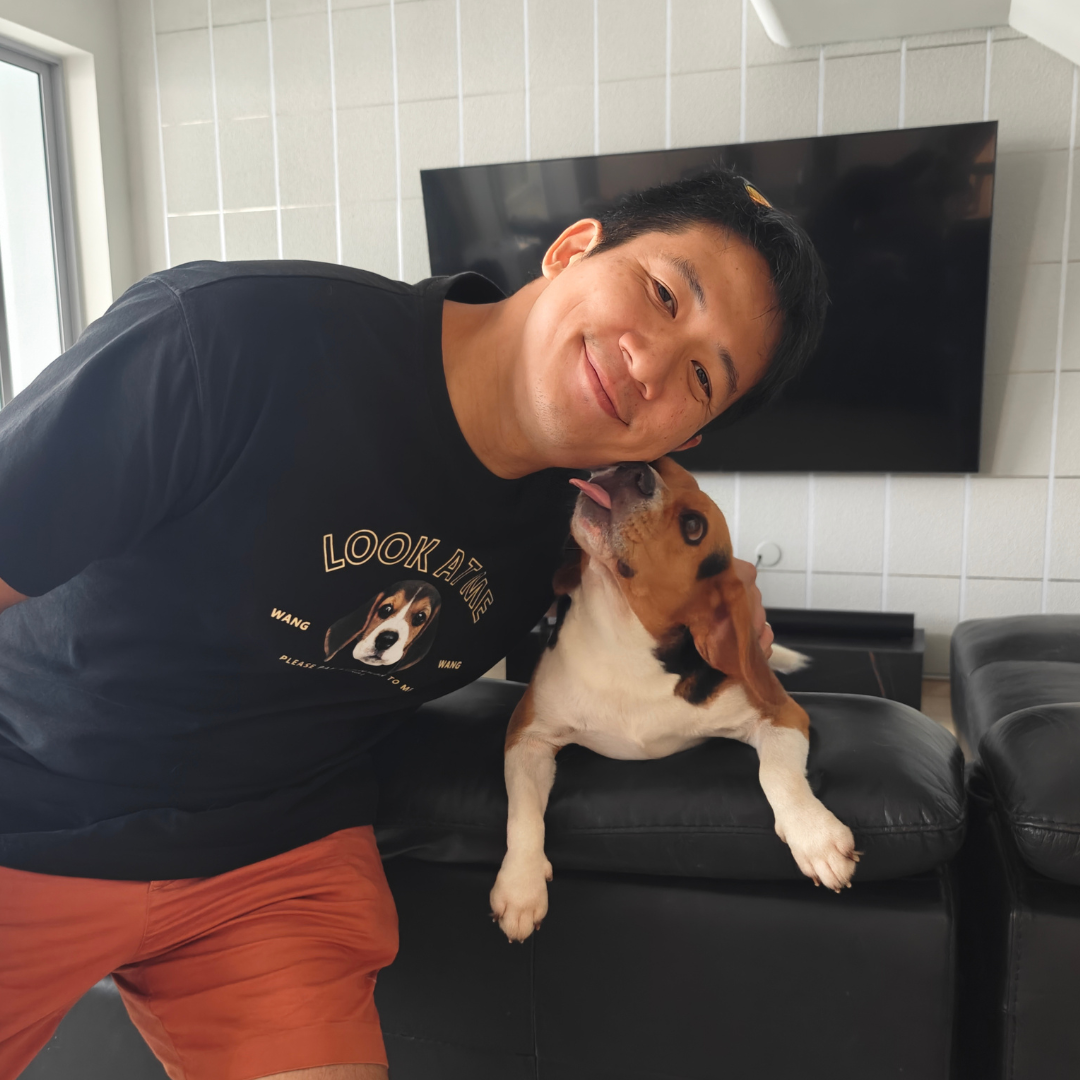 Tan with Belly, one of his three beagles that inspired his symbol for GE2025 (Credit: Jeremy Tan)