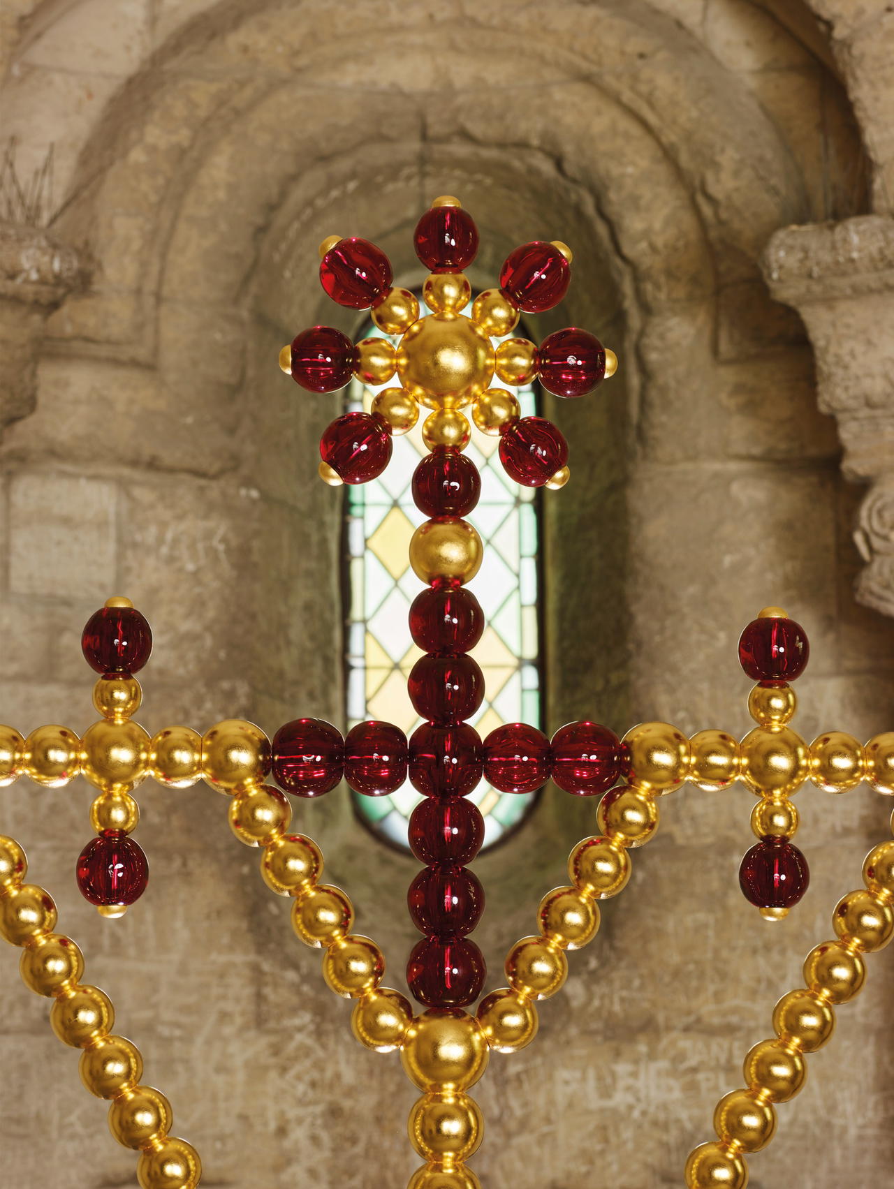 One of Jean-Michel Othoniel’s golden metal and red glass bead crosses on the Pont d’Avignon (Credit: Jean-Michel Othoniel)