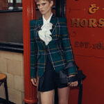 Polished suit skirts, crisply tailored blazers, structured bags, and a quiet confidence are the hallmarks of this new era (Credit: McQueen)