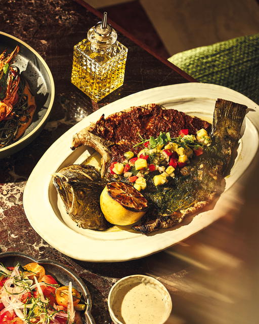 Seabass with adobo, parsley-lime rub, and pineapple salsa from the Grilled Catch selection (Credit: Cudo)