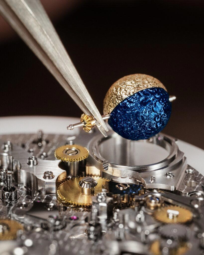 The spherical moon is made of titanium—one hemisphere in gold PVD, the other in deep blue (Credit: Vacheron Constantin)