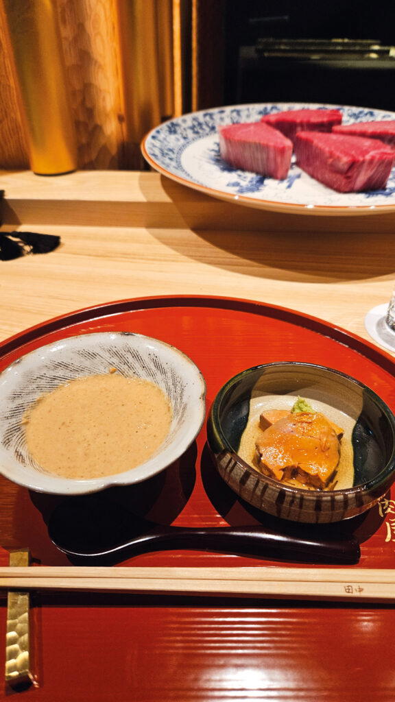 Tanaka serves shabu-shabu with his sesame sauce containing ankimo morsels, along with a side of ankimo (Credit: Candice Chan)