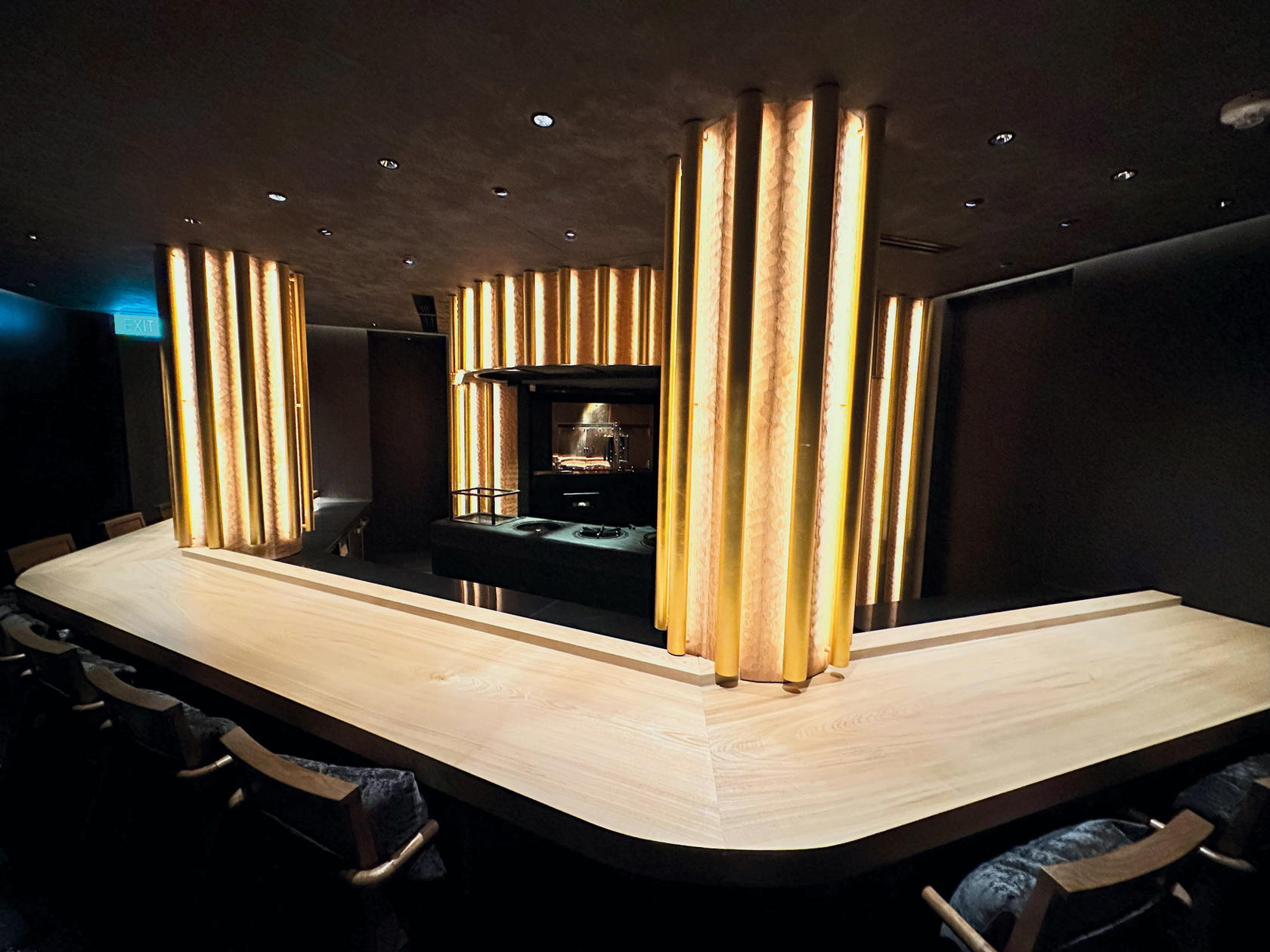 With its charcoal grey ceiling and dark wooden walls, the 10-seat naguri wood chef’s counter stands out. Naguri is not a wood, but a woodworking technique that creates a tactile surface, so knives don’t dull, ensuring precise meat cutting (Credit: Nikuya Tanaka)