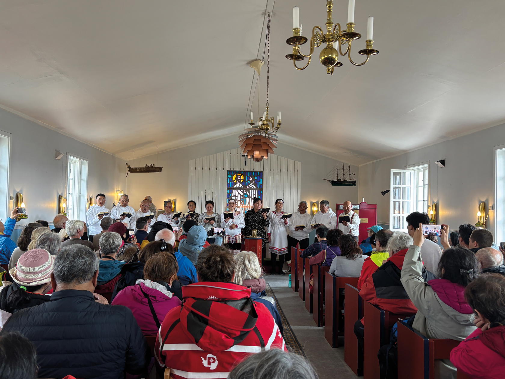 A choir singing in a Kuummiut church (Credit: Kalpana Sunder)