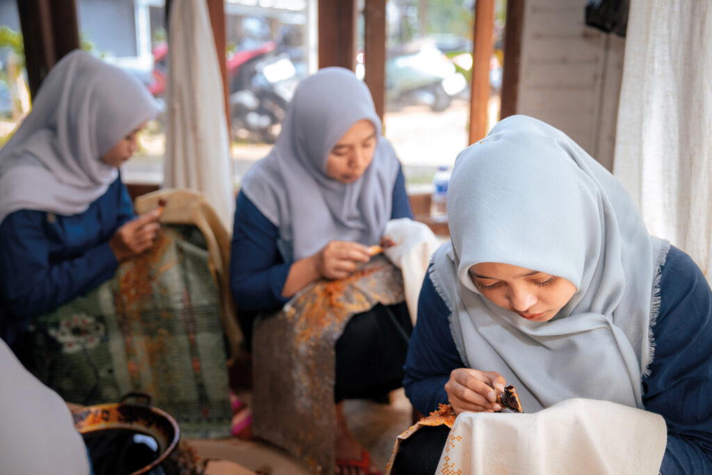 In batik, textiles are drawn on with dye-resistant wax, leaving intricate designs behind when dyed. This indigenous knowledge will continue to be passed down through SukkhaCitta’s craft schools (Credit: Rolex)