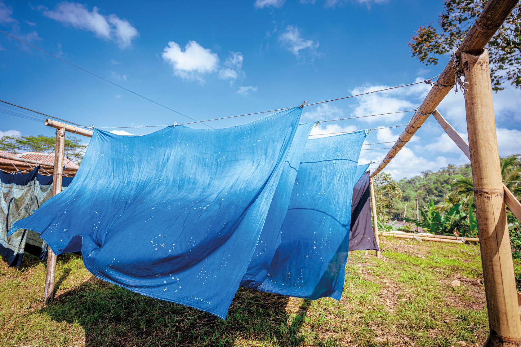 Textiles drying at one of the Rumah SukkhaCitta craft schools. They are coloured with SweetIndigo, a signature SukkhaCitta plant-based dye developed without chemicals or waste (Credit: Rolex)