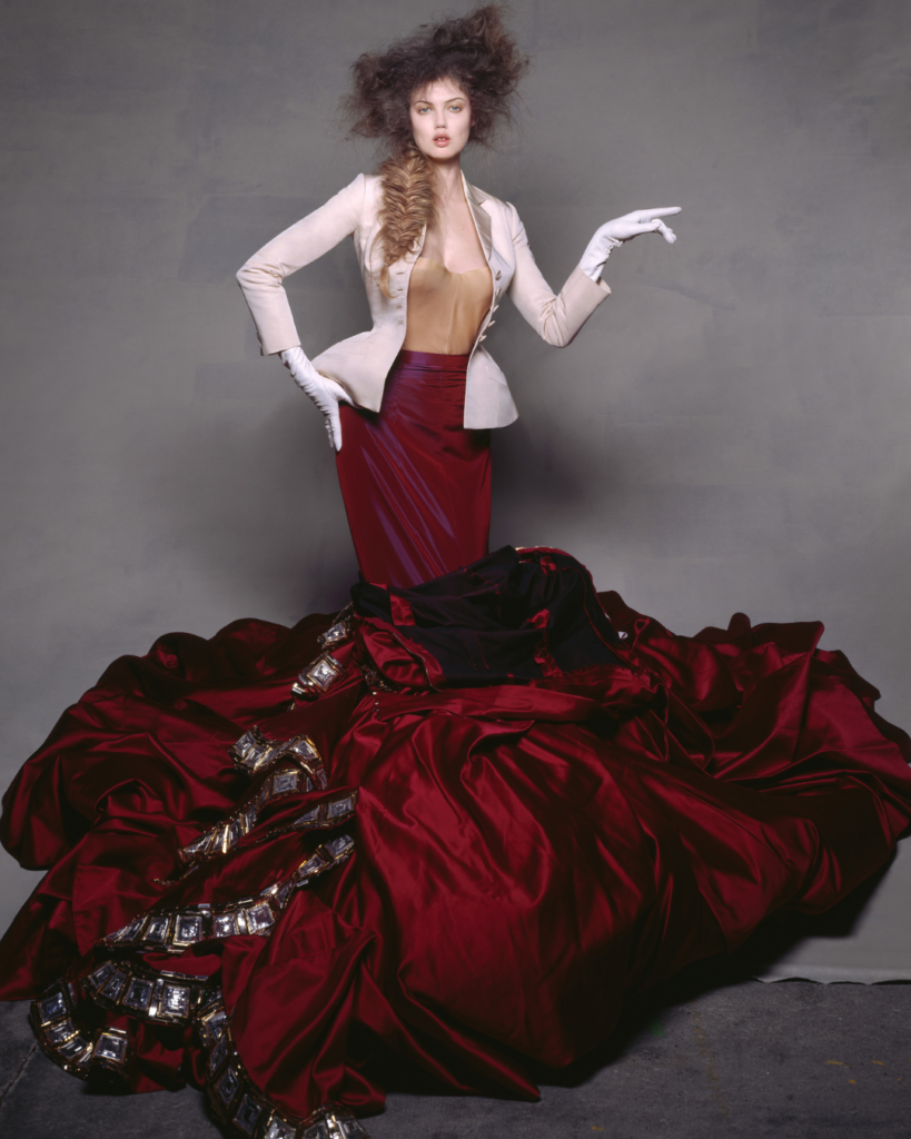 Christian Dior Bar jacket in ecru shantung. Haute Couture Spring-Summer 1947. Christian Dior by John Galliano. Dress in red satin embroidered with gold and silver beads and paillettes with rhinestone jewellery. Haute Couture Autumn-Winter 2004 Dior Héritage collection, Paris (Credit: Concept and photography by Brigitte Niedermair)