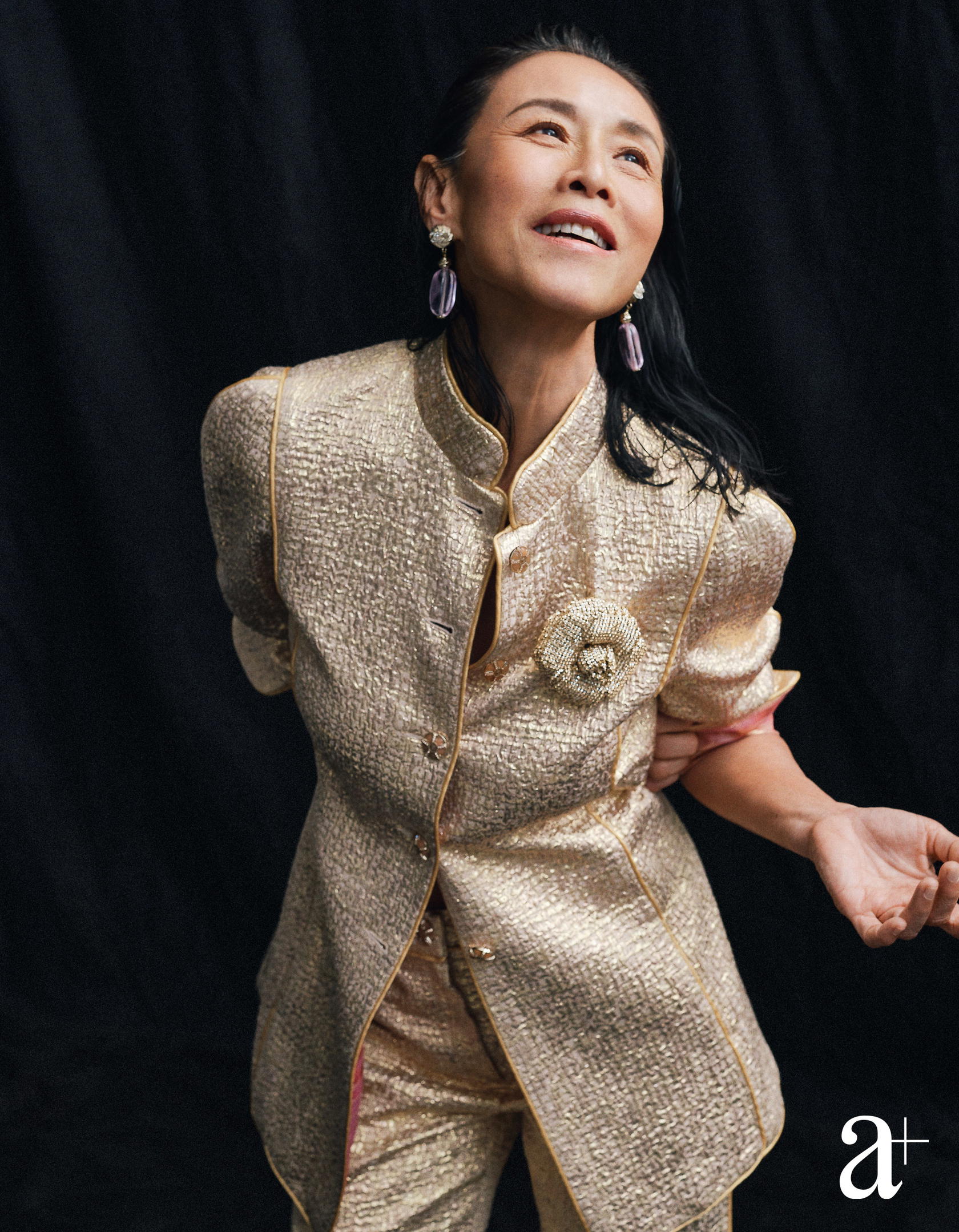 Embossed silk crepe jacket with matching trousers, metal earrings embellished with glass and strass, and strass and metal brooch, all from Chanel (Credit: Stefan Khoo)