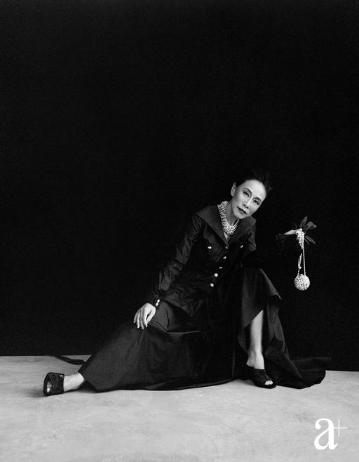 Silk taffeta jacket and matching skirt, silk satin gloves, metal and strass minaudiere, metal necklace embellished with strass and glass, and leather and diamante mules, all from Chanel (Credit: Stefan Khoo. )