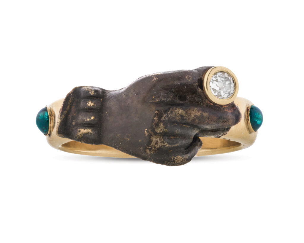 Hand In Hand Ring in yellow gold with a diamond, green garnets, and a fragment from a medieval fede ring (Credit: Rebecca Rau)