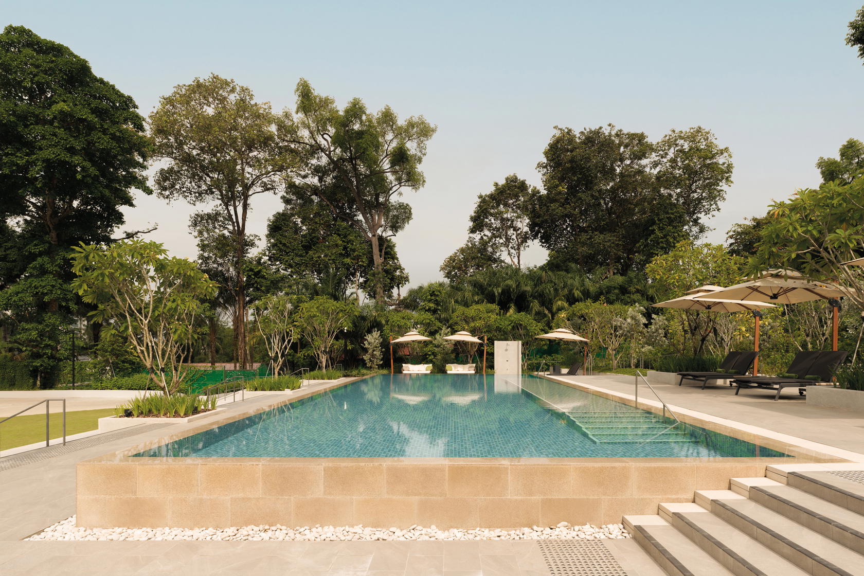Dive into serenity at the swimming pool, embraced by a tranquil oasis of lush greenery (Credit: The Initial Sama)