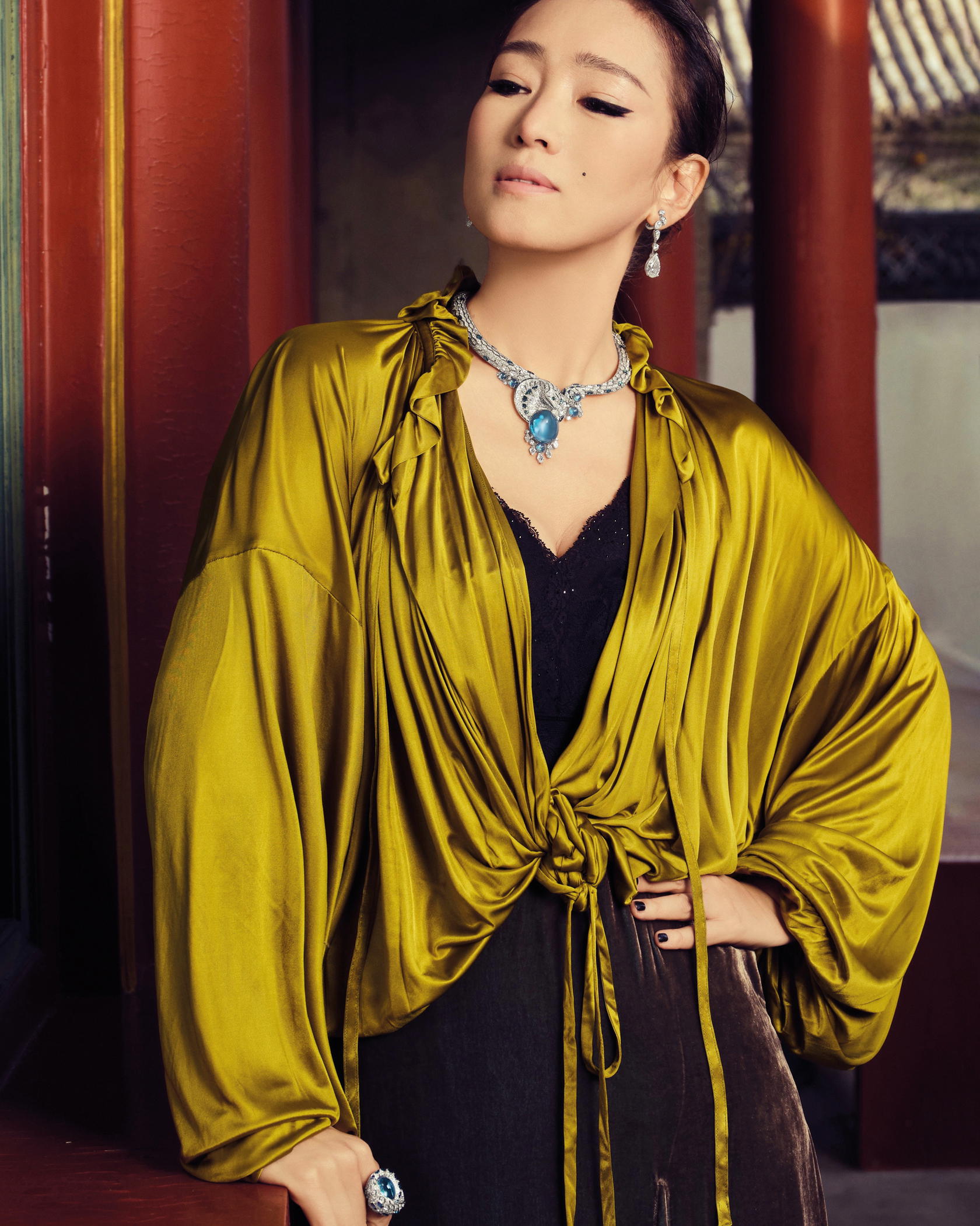 Actress and brand ambassador Gong Li wearing the Najaatra necklace in white gold with a 51.7-ct aquamarine, diamonds, aquamarines, and tourmalines (Credit: Cartier)