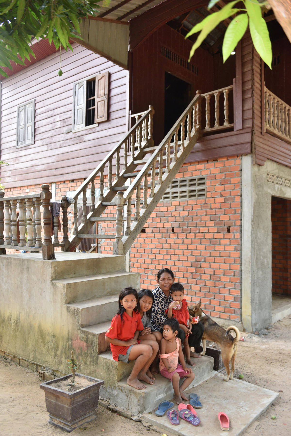 A Shinta Mani Foundation micro-loan recipient who started a pig farm (Credit: Shinta Mani Foundation)