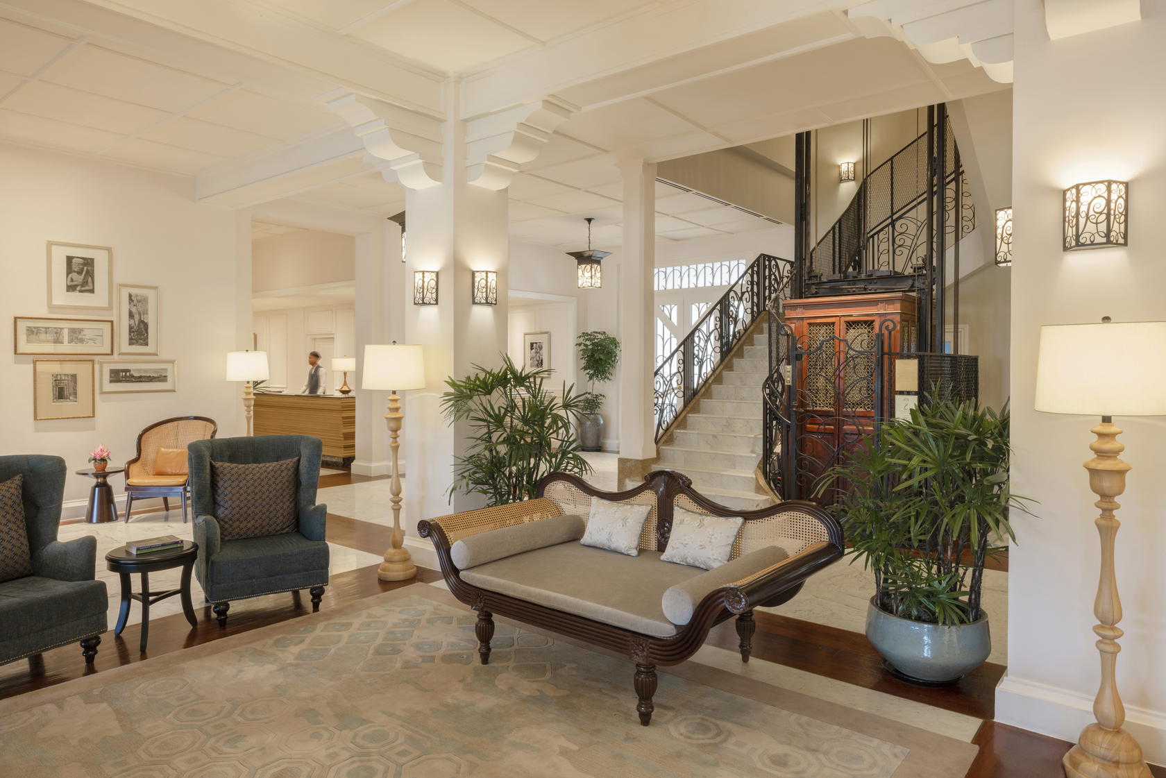 The timber and wrought-iron elevator at the heart of the lobby at Raffles Grand Hotel d’Angkor is original to the building, carefully restored, and still in operation today (Credit: Raffles)