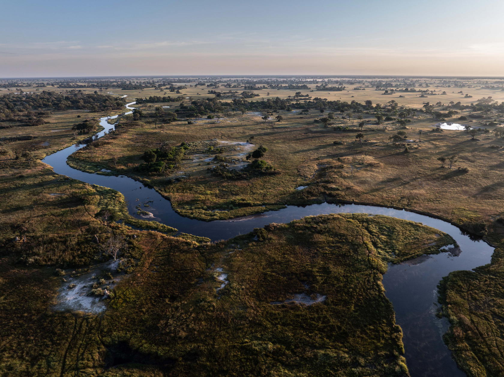 An aerial view of the Kwando River Basin in Botswana, which flows into the Zambezi. Its rushing waters sustain many animals and plants, as well as more than 20 million people (Credit: The Wilderness Project/James Kydd)