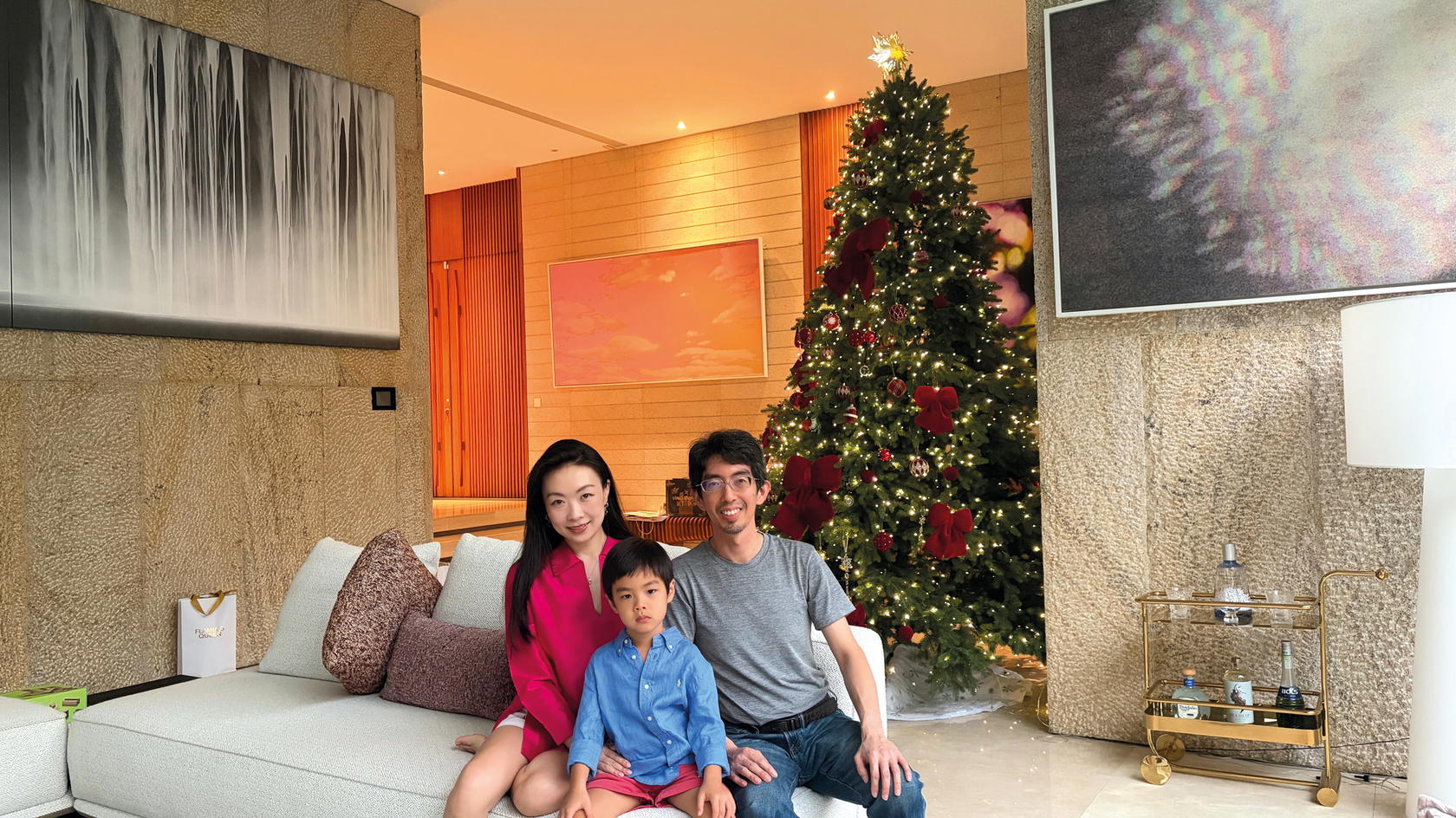 The Angs (pictured with their son) expanded their collection at Art SG 2026 (Credit: Bruce & Lulu Ang)