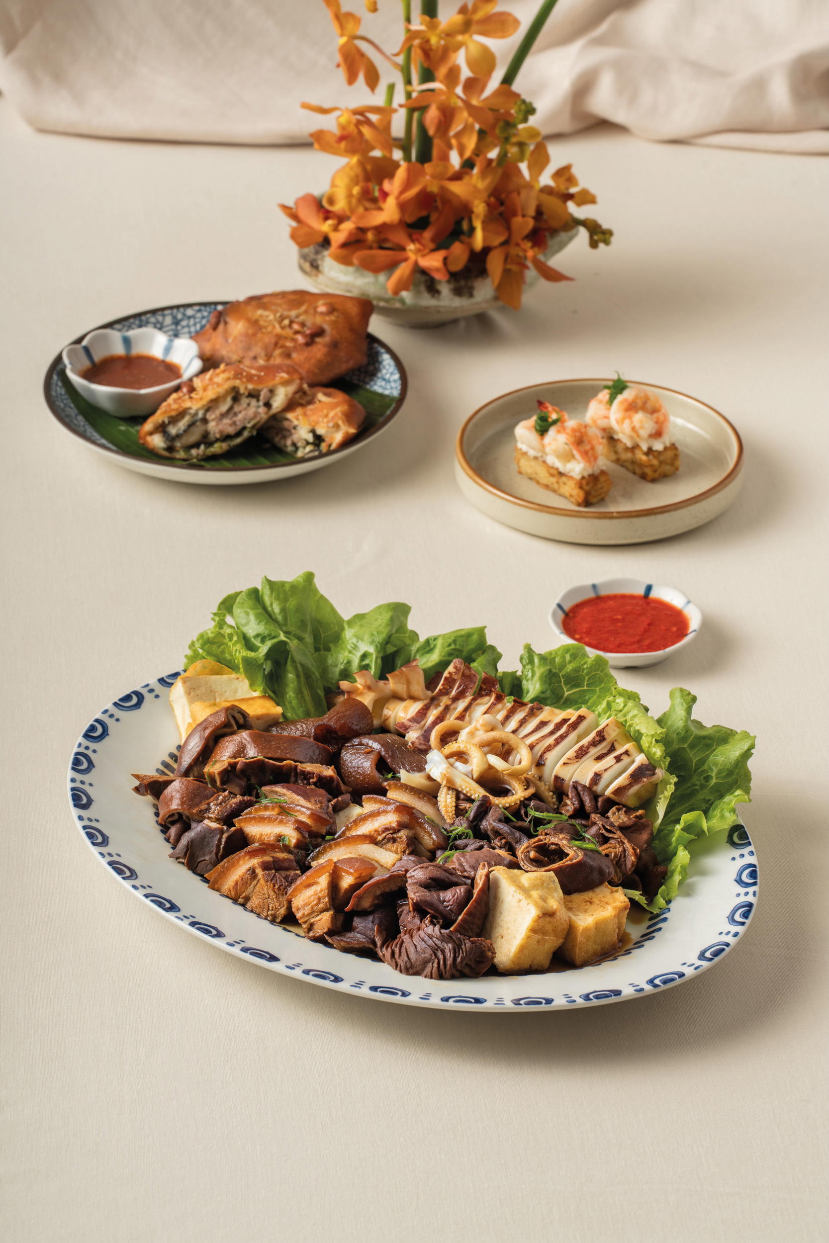 Starters include Sey Bah (Braised Pork Belly & Offal) (Credit: Gilmore & Damian D’Silva)