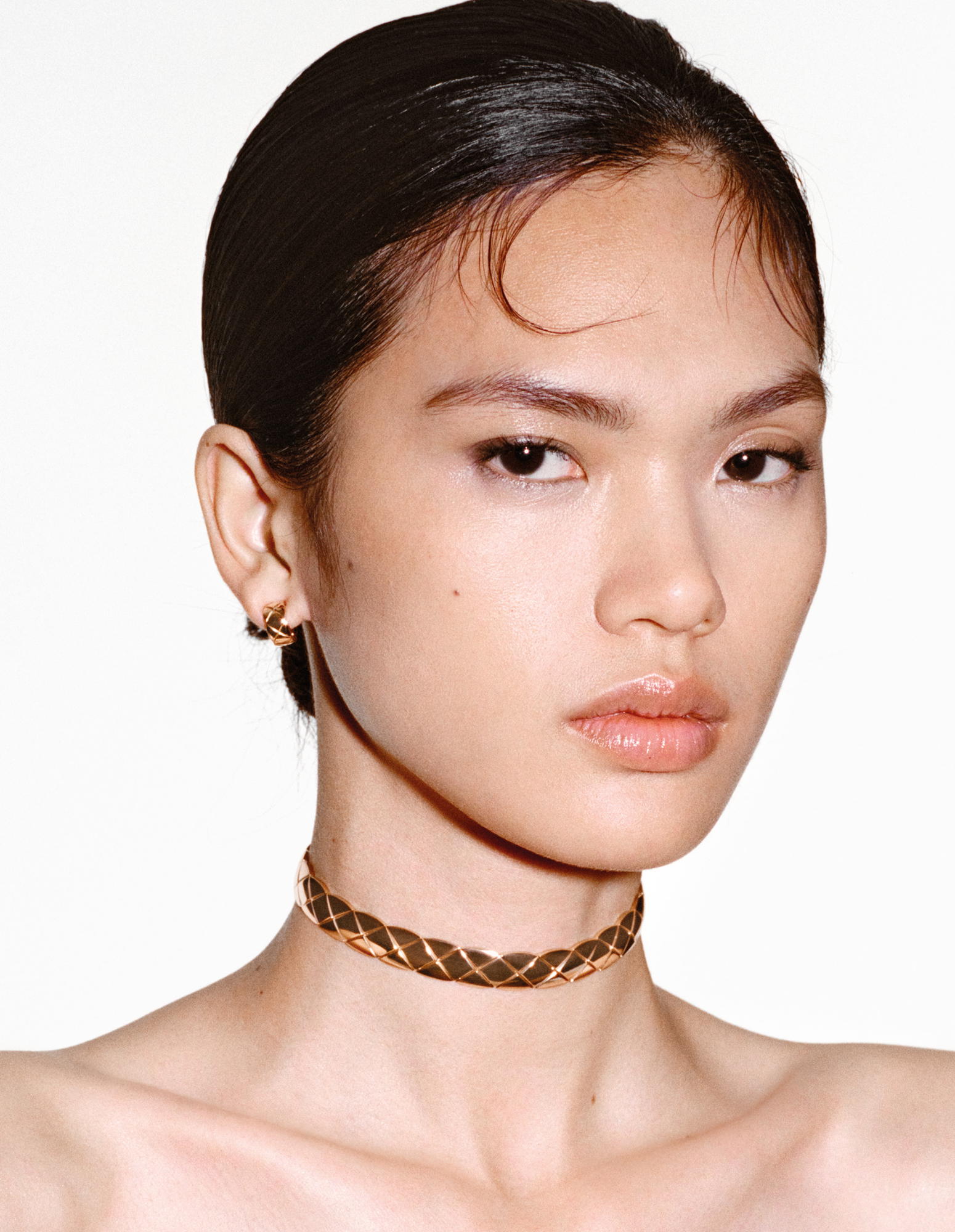 Coco Crush supple choker in beige gold. With its neutral, universally flattering tone, beige gold is a direct representation of Gabrielle Chanel’s own colour palette and is neither too cool nor too warm. The founder saw beige as a symbol of nature; a reminder of the wet sands of Deauville Beach in Normandy and the raw, unbleached colour of her first jersey collections in the 1920s (Credit: Chanel)