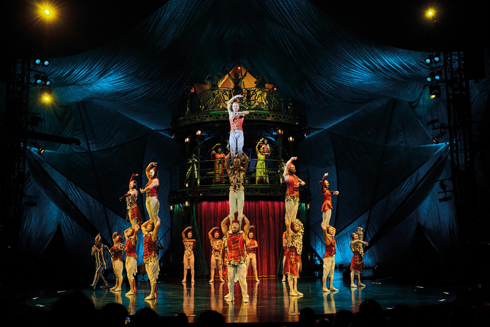 During the ‘Charivari’ act, performers stack themselves into pyramids before attempting daring dives (Credit: Cirque du Soleil)