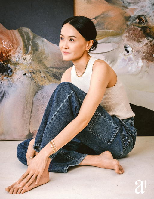 Coco Crush hoops in beige gold, Coco Crush supple necklace in beige gold, Coco Crush bracelets in beige gold with and without diamonds, and Coco Crush ring in beige gold with diamonds. Silk top and denim jeans all from Chanel (Credit: Stefan Khoo)