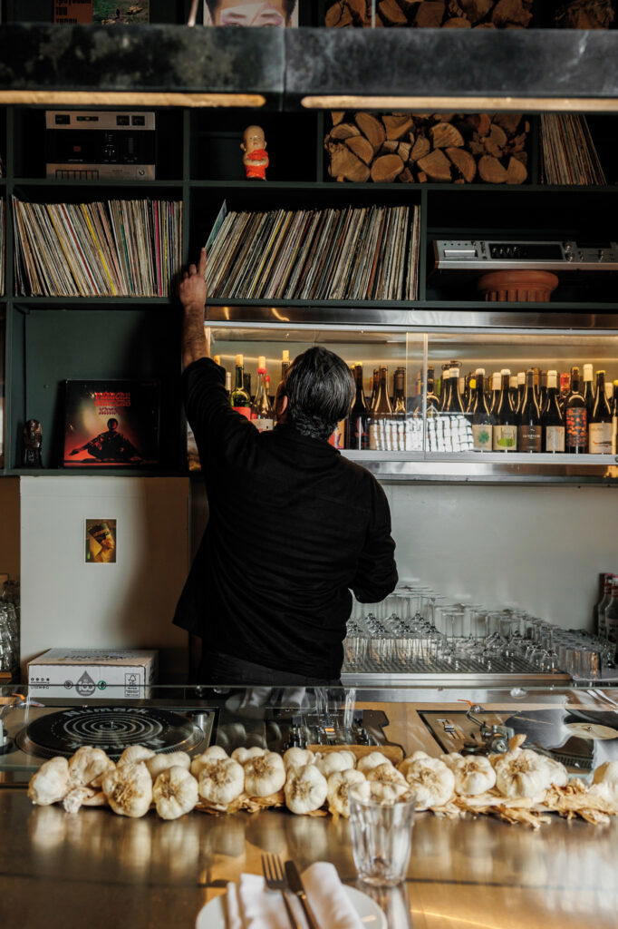 Pharaoh offers rustic dishes, a cellar of natural wines, and (right) lively music from co-founder Vallatos’ personal vinyl collection, played on decks behind the counter (Credit: Pharaoh)
