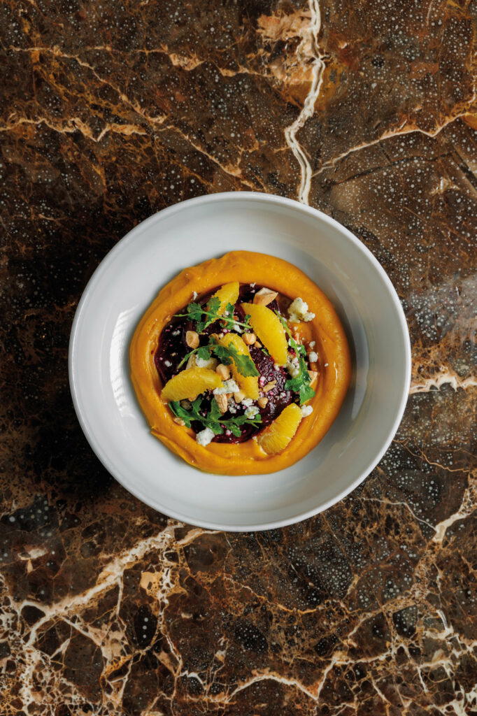 Pharaoh offers rustic dishes, a cellar of natural wines, and (right) lively music from co-founder Vallatos’ personal vinyl collection, played on decks behind the counter (Credit: Pharaoh)