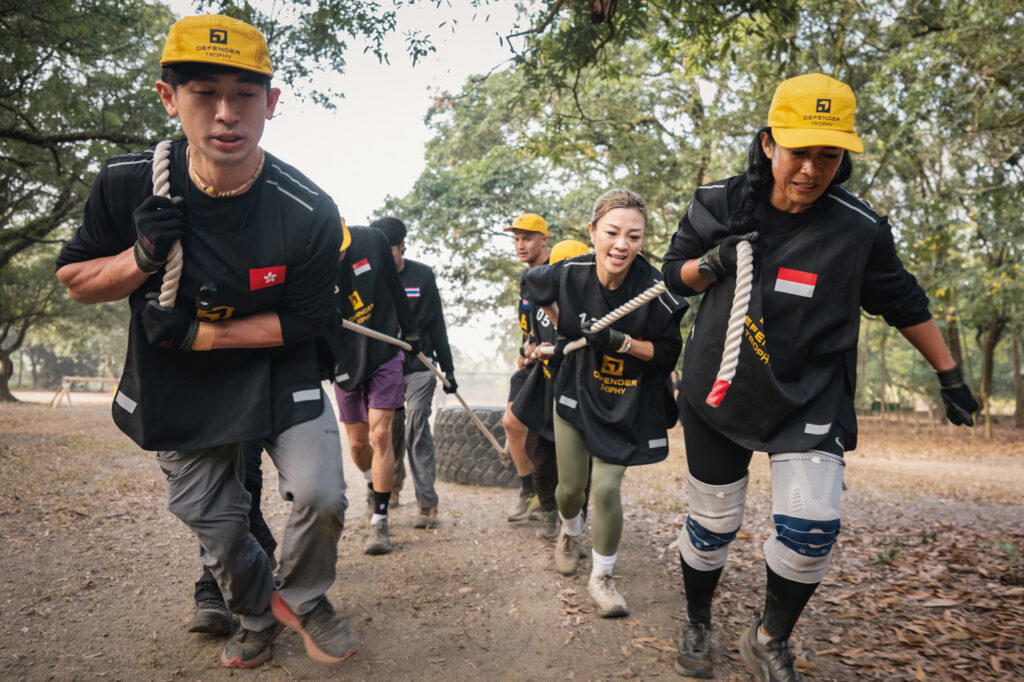 Teams had to drag a large tire for 80m in the Physical Team Challenge Weighted Load (Credit: Defender)